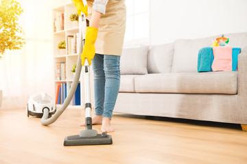 Woman use vacuum cleaner to cleaning