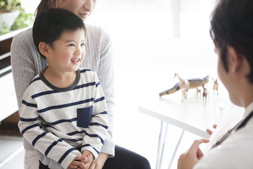 Mother and son are consulting with a clinic