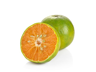 green tangerine on white background