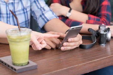 three people using smartphone in coffee shop, internet of things