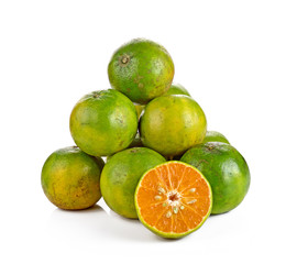 green tangerine on white background