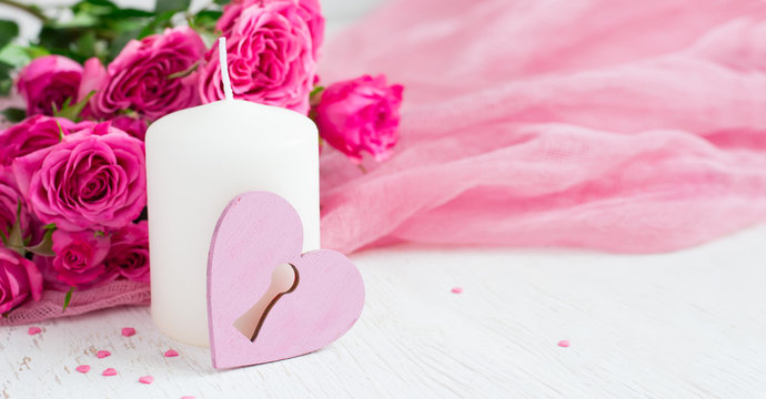 Valentine day background with roses and candle