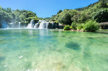 A low view from the water of Skradinski Buk, the main waterfall and tourist attraction at Krka National Park in Croatia.