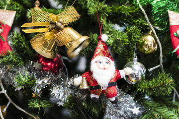 Jingle bell hanging on a Chrismas tree.