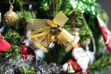 Jingle bell hanging on a Chrismas tree.