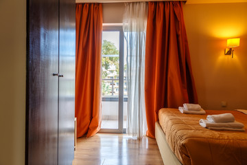 Interior of hotel room with access to the balcony modern European resort