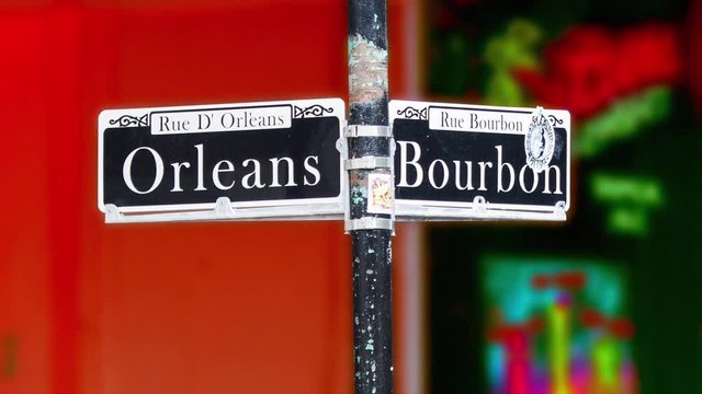 New Orleans Bourbon Street Sign with a Vibrant Colored and Out of Focus Background during French Quarter Festivities