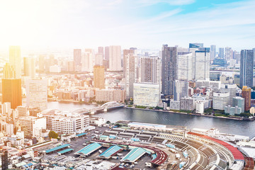 Asia Business concept for real estate - panoramic modern cityscape building bird eye aerial view of Odaiba bay and rainbow bridge under sunrise and morning blue bright sky in Tokyo, Japan.