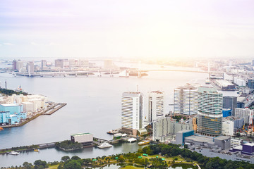 Fototapeta premium Asia Business concept for real estate - panoramic modern cityscape building bird eye aerial view of Odaiba bay and rainbow bridge under sunrise and morning blue bright sky in Tokyo, Japan.
