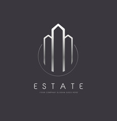 Real Estate Logo with tree buildings and simple gold design.