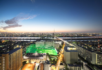 Obraz premium panoramic modern city skyline bird eye aerial night view with tokyo skytree under dramatic neon glow and beautiful dark blue sky in Tokyo, Japan