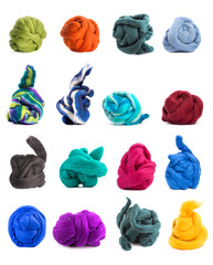 Коллаж из разноцветных мотков мериносовой шерсти на белом фоне
