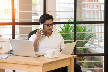 casual indian male working at office