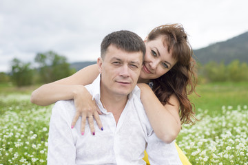 Lovers meet men and women on a beautiful flower field.