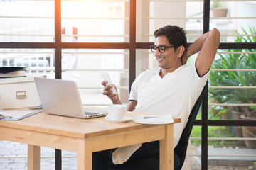 casual indian male working at office