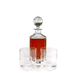 Crystal decanter with whiskey and empty glasses