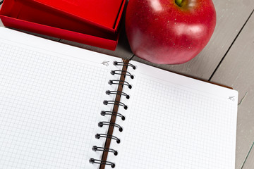 Notebook and apple