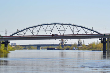 Fototapeta premium Two bridges through the Tura River in Tyumen, Russia.