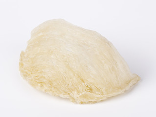Edible bird nest with the white background. Bird nests that are prepared and eaten by humans, particularly prized in Chinese culture