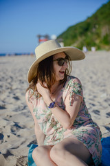 Young happy woman on the beach