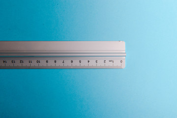 aluminum ruler on blue background