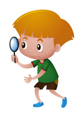 Little boy looking through magnifying glass