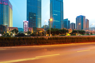 Fototapeta na wymiar City building street scene and road of night scene