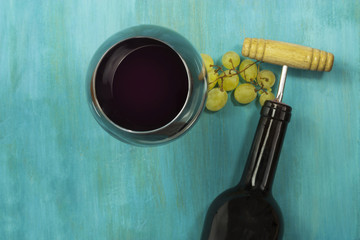 Wine background with glass, grapes, bottle, and copyspace