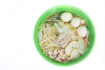 Noodles in green bowl on white background.