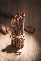 Cinnamon sticks on wooden table.