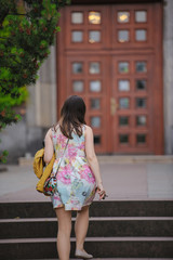 Fototapeta premium pretty young woman having fun in the city with camera travel photo of photographer