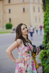 Female tourist takes picture in historic city