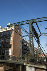 Fototapeta premium Modern green bridge in Amsterdam in the day
