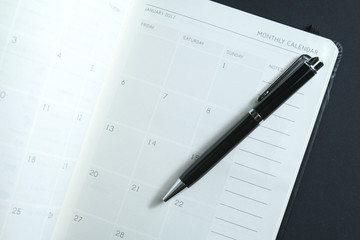 Naklejka premium First page of calendar on planner for year 2017 with focus on January 1st.