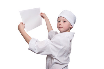 Boy dressed as doctor with a white sheet of paper in his hands o