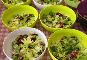bowls of lettuce and salad in the canteen