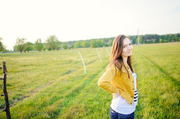 Happy young girl enjoying the beauty of sunny spring day