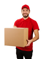 delivery service - young smiling courier holding cardboard box - obrazy, fototapety, plakaty