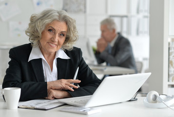 Senior businesswoman with laptop