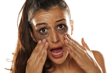 Young beautiful women applied a cream to remove her makeup