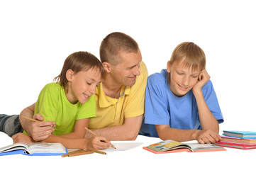 Fototapeta na wymiar father with sons doing homework