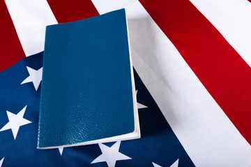 Bible laying on top of an american flag