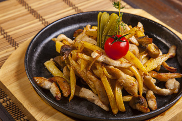 fried potatoes with mushrooms and chicken