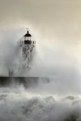 Gordijnen Old lighthouse during heavy ocean storm © Zacarias da Mata