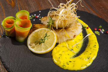 Pike perch with sauce and lemon