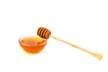 Honey in jar or bowl with wooden stick isolated on white background