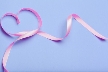 ribbon HIV, AIDS on blue background