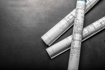 Construction planning drawings on black background