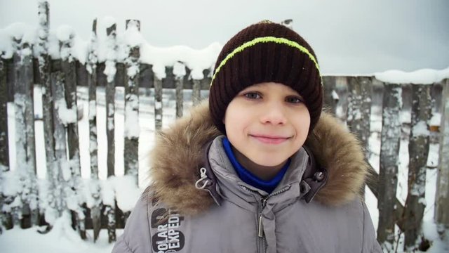 Portrait of a smiling boy in winter