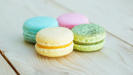 colorful cake macaron or macaroon on wooden background.